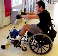 Photo of a man who uses a wheelchair using the Motomed Viva.