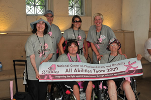 Image of the 2009 All Abilities Team holding their banner