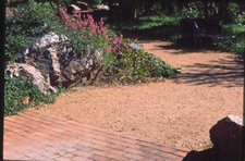 Compacted crushed stone paving used to make a path 6 feet wide at a park.
