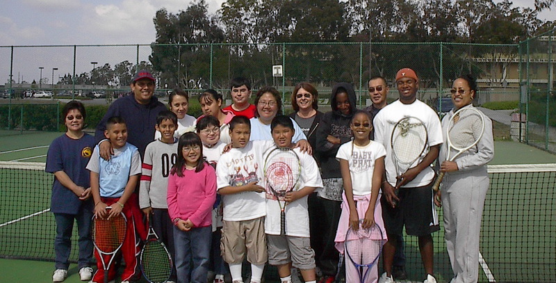 members of the DhhEAF program stand in front of a tennis net