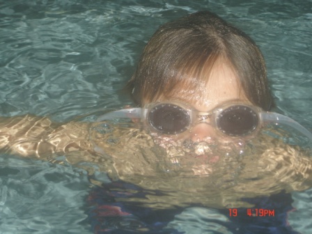 a child practices going under water