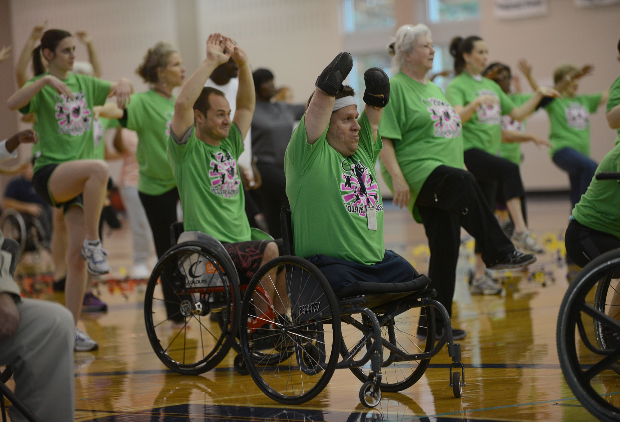a group of people participate in an inclusive fitness class