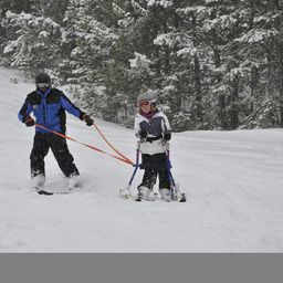 NSCD instructor and participant engaging in adaptive skiing