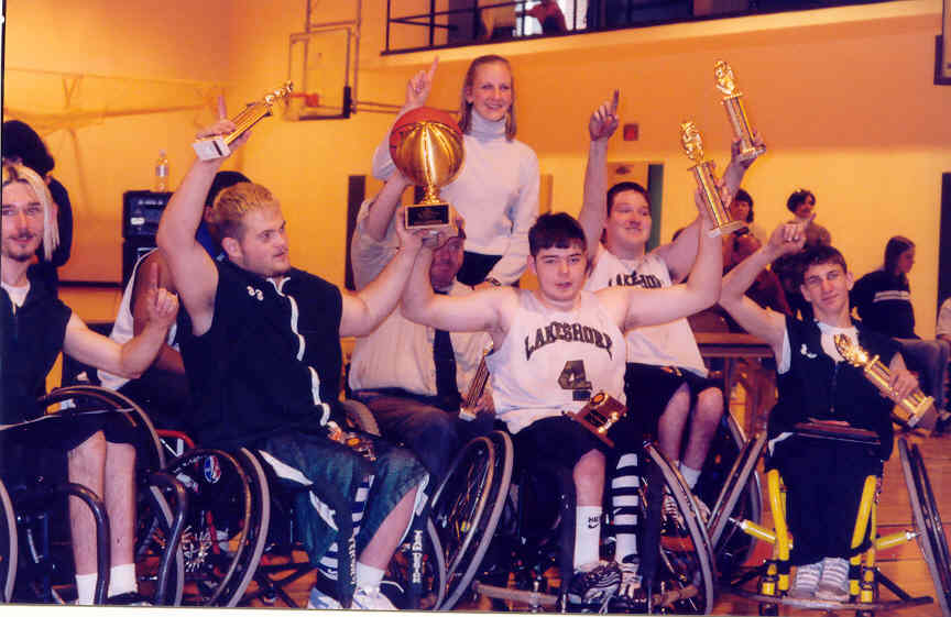wheelchair basketball team celebrating winning a championship