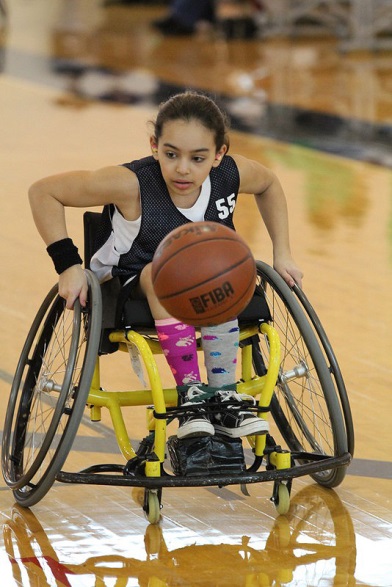 girl plays wheelchair basketball