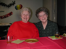 Two older women smiling at the camera