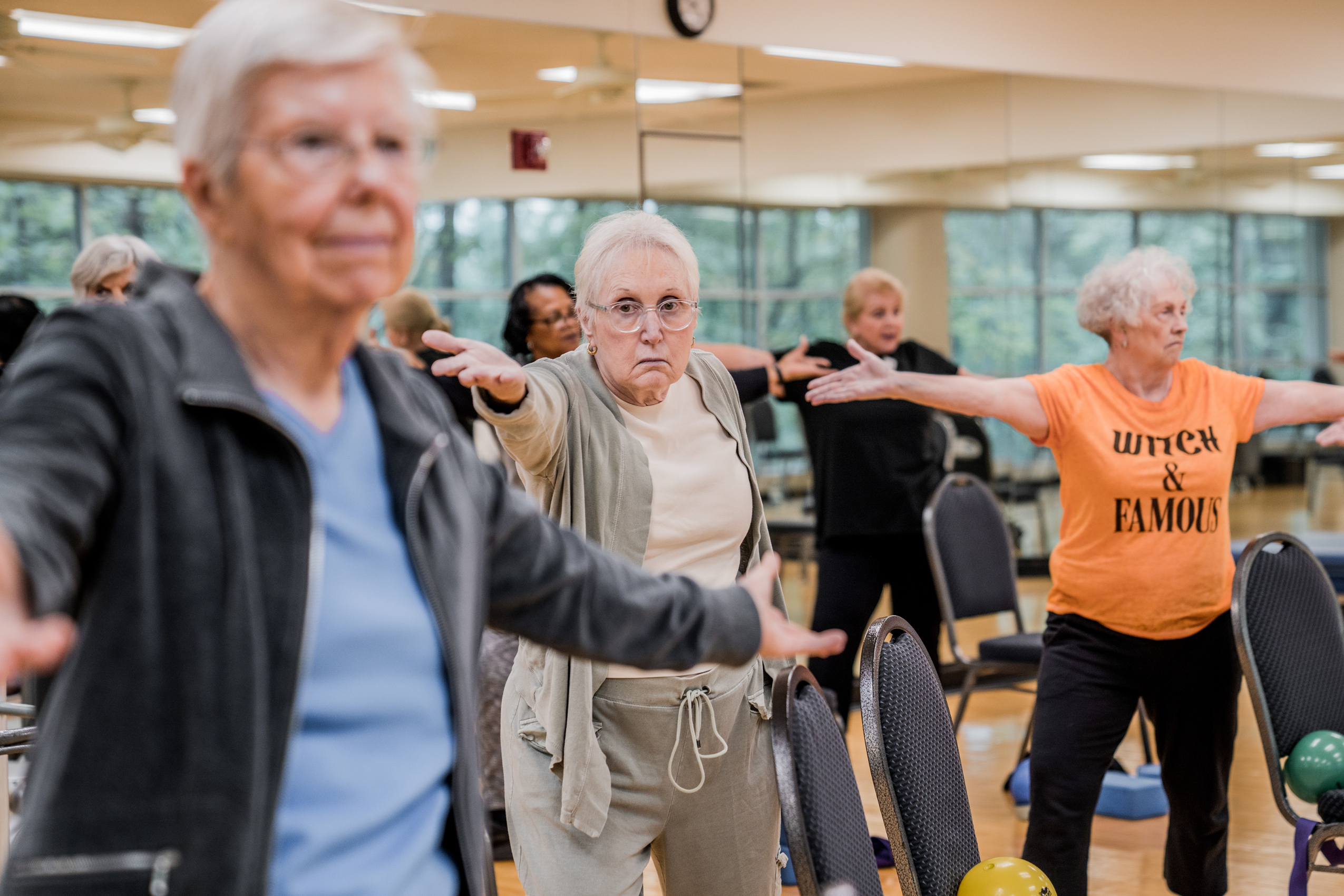 Older women performing yoga