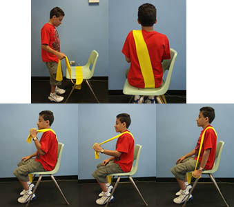 Child with Spina Bifida is performing an Elbow Extension from a seated position.