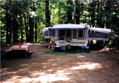 A trailer is shown in a wooded area