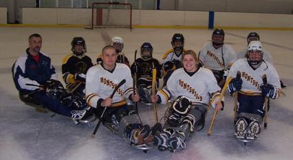 Image of a sledge hockey team