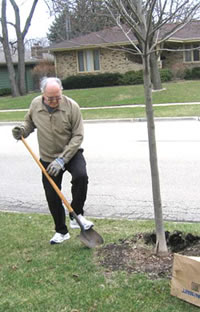 The author's father in law shoveling dirt