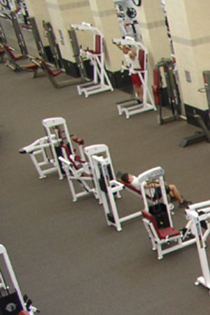 Aerial view of fitness equipment arranged in rows at a fitness center