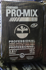 A 3.8 cubic foot compressed rectangular bale of Pro-Mix brand Soilless mix.