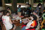 Several campers sitting around a table.