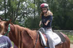 Sarah Leone riding a horse.
