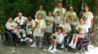 Group photo of campers wearing matching yellow t-shirts.