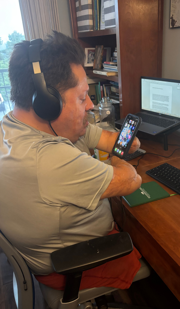 NCHPAD Expert Information Specialist Bob Lujano using adaptive technology.